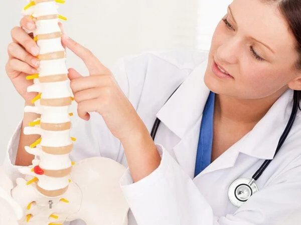 doctor pointing on a spine