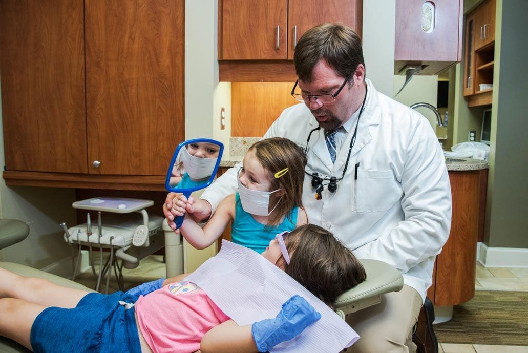 Dr. Eric Johnson with Patients - Dentist Topeka KS