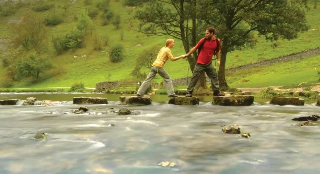 Teens on stepping stones