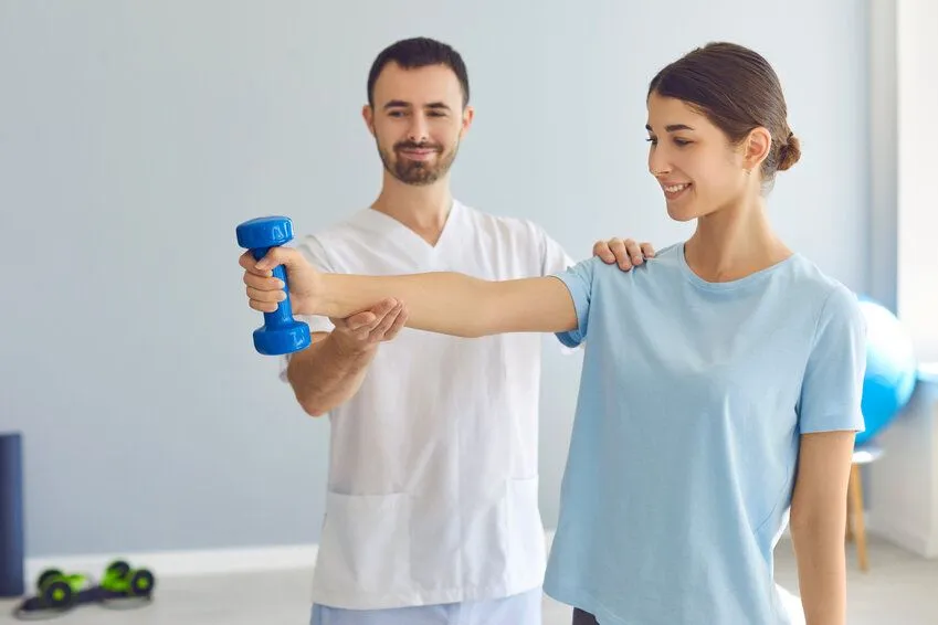 doctor instructing patient about strengthening exercises