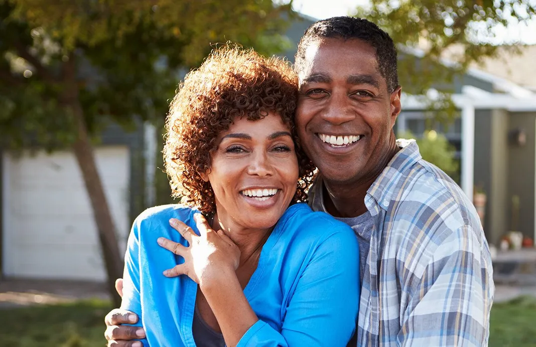 older couple outside their home