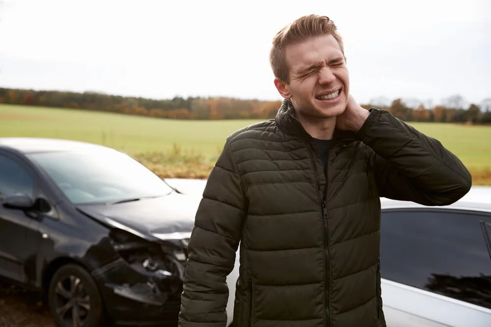 Man with whiplash after a car accident.