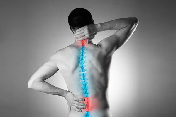 man iwith back pain and spine overlay