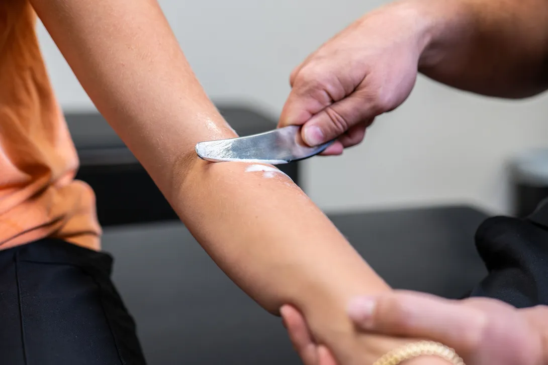 Female holding shoulder in pain