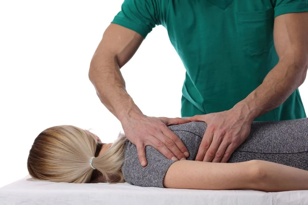 chiropractor with patient