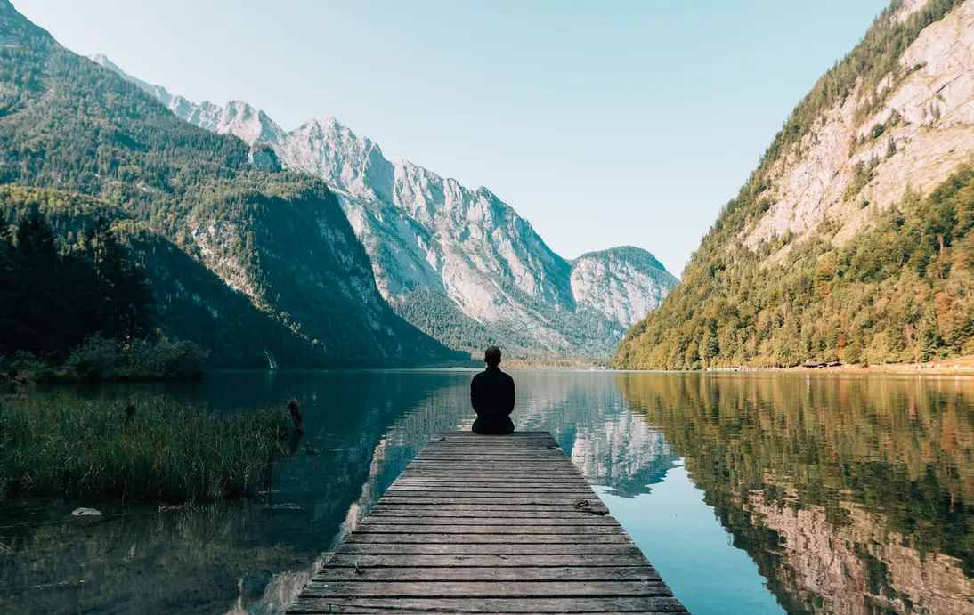 person sitting on dock