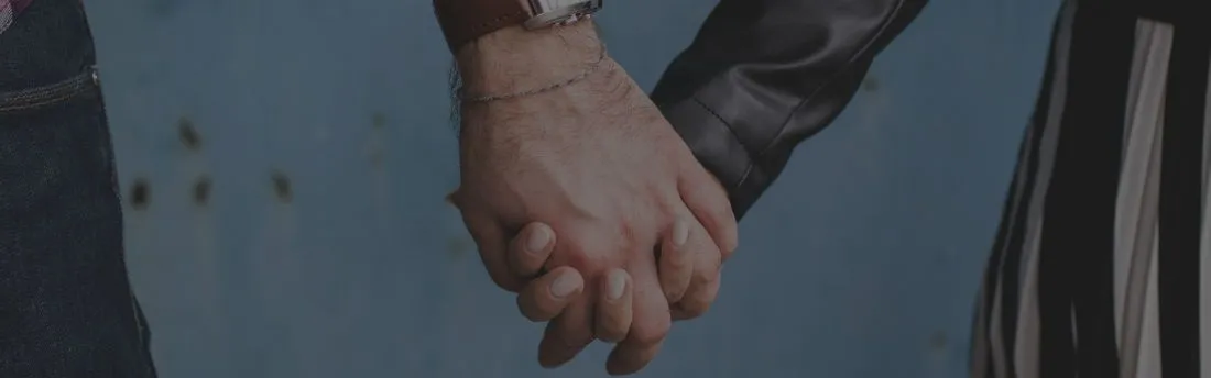 eldery couple's hands holding each other