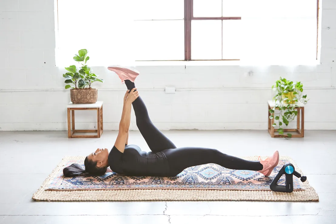 woman stretching on floor