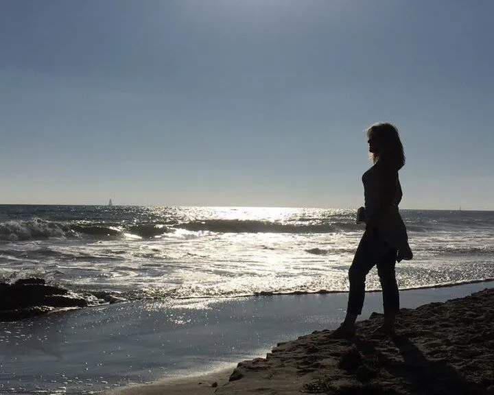 individual standing on the beach