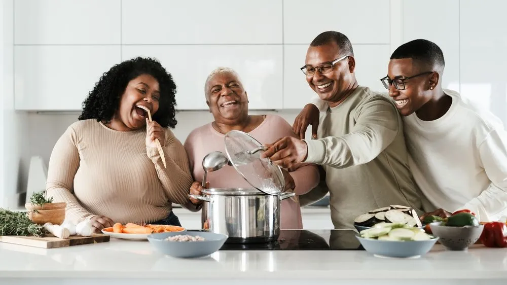 family cooking in kitchen