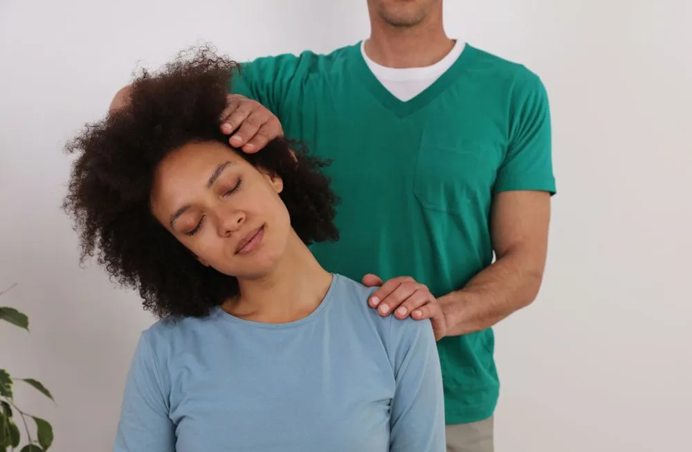 young woman in chiropractic exam