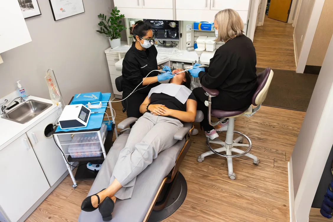 Dr. Ramesh doing dental implant work on patient at Coolidge Corner Dental, dental implants Brookline, MA implant dentistry