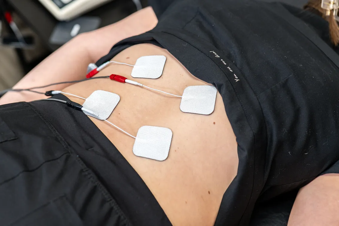 Female with device on back