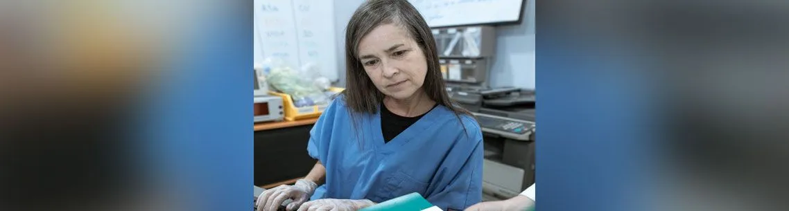 woman on dental staff using computer, front office dental training, dental software training