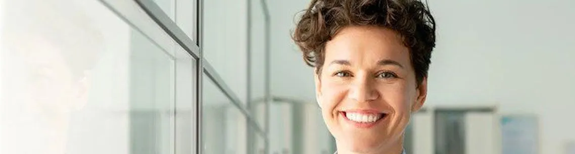 woman with short brown hair smiling, Academy of Dental Practice Careers, dental insurance courses online