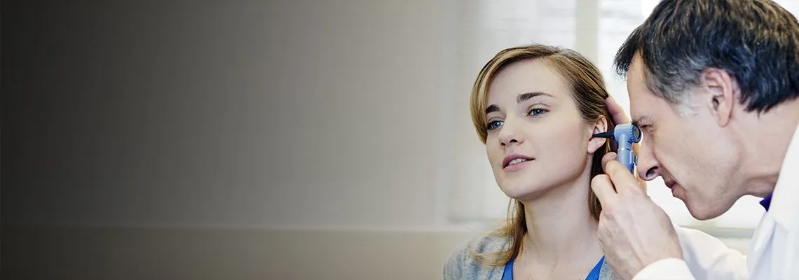 Banner picture, doctor checking woman's ear
