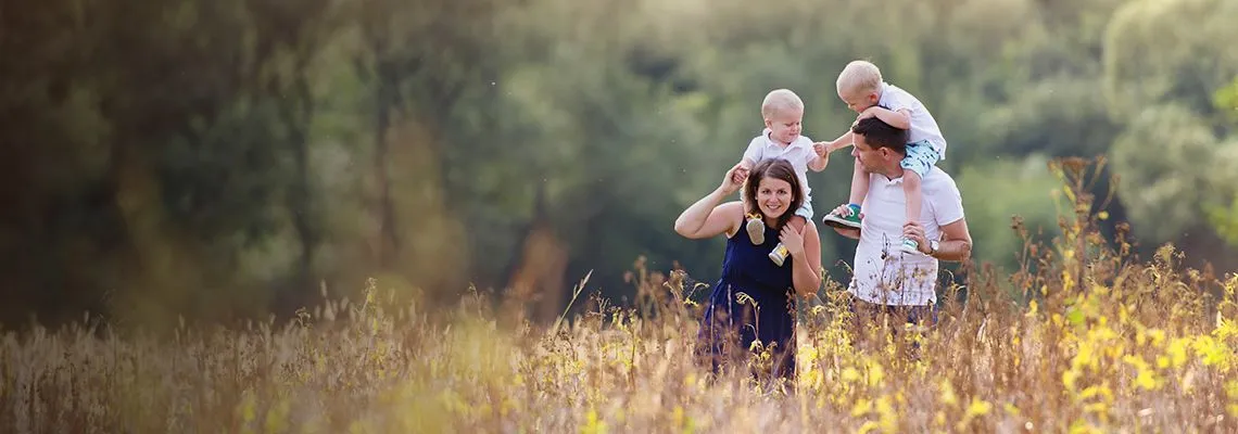 banner picture, couple walking with babies on the shoulders