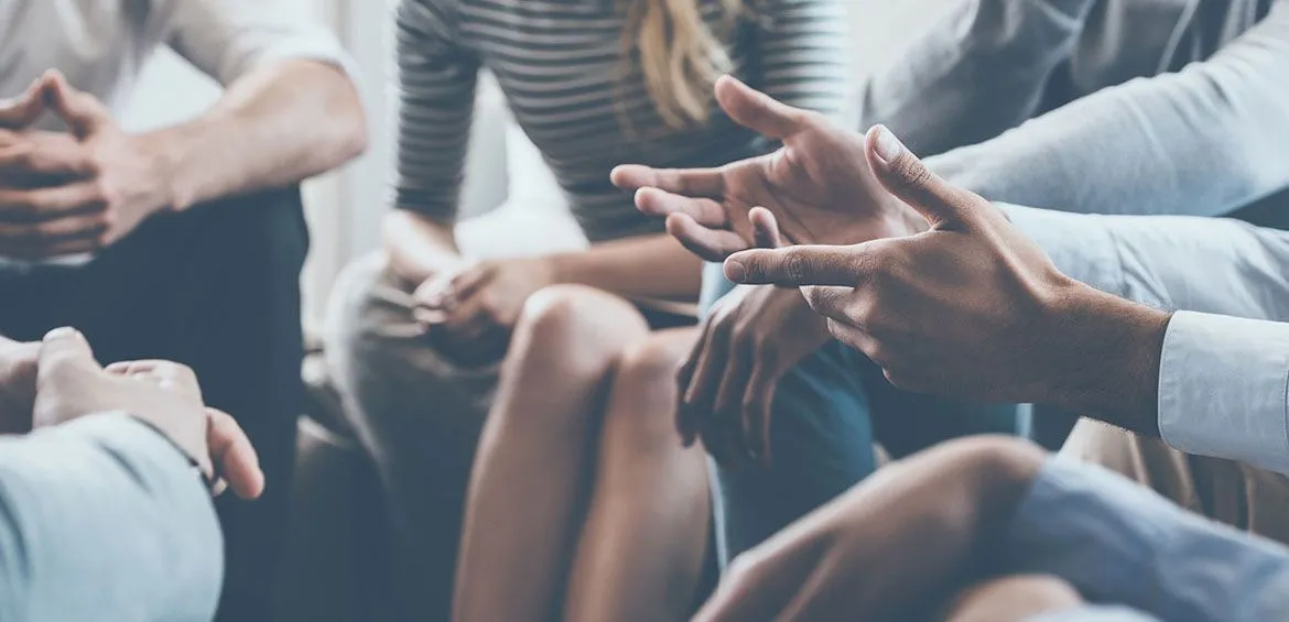 Group of people talking in a therapy