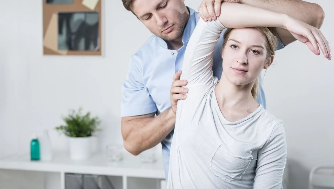 chiropractor giving woman an adjustment