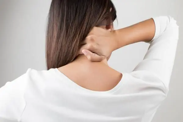 Patient suffering from neck pain and in need of chiropractic care