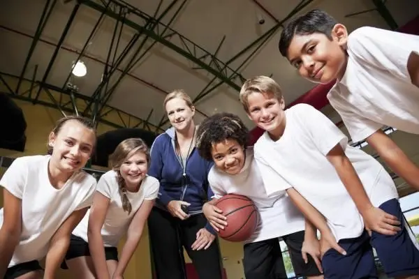 Kids playing basketball and in need of goggles for their vision