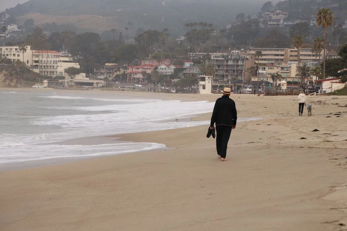 man walking on the beach