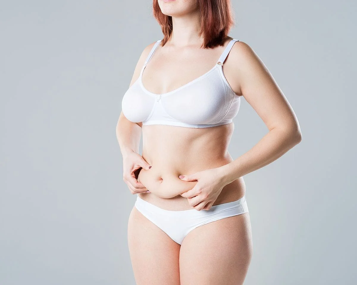 Photo of a woman who is thinking about liposuction surgery.