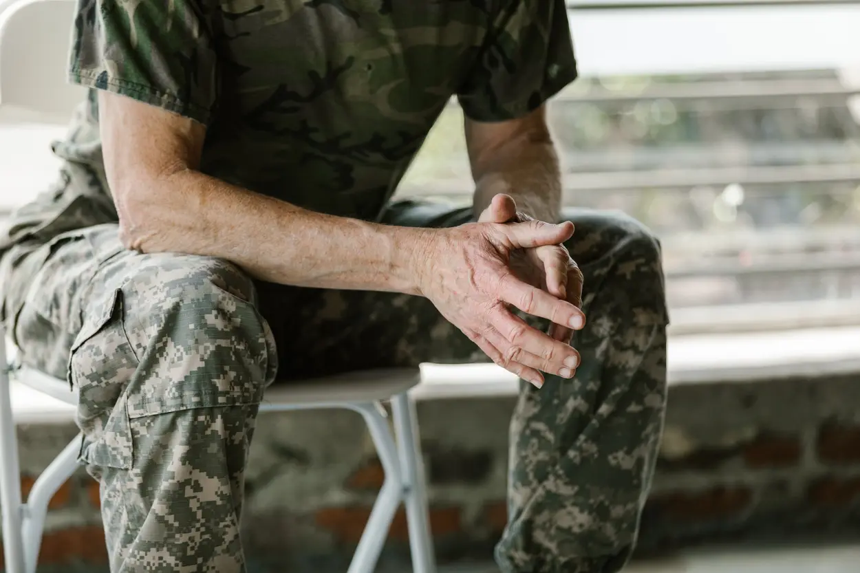 anonymous man in military fatigues