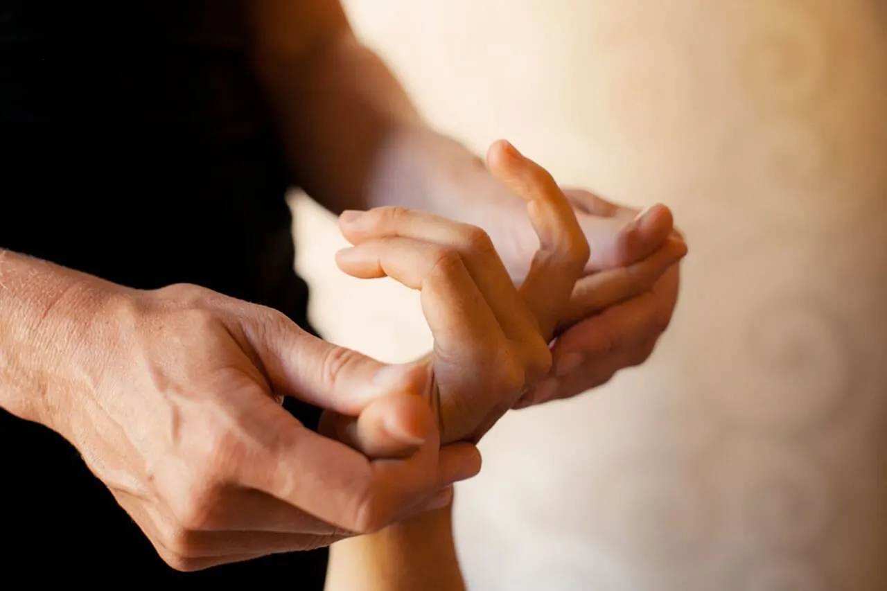 doctor massaging a hand
