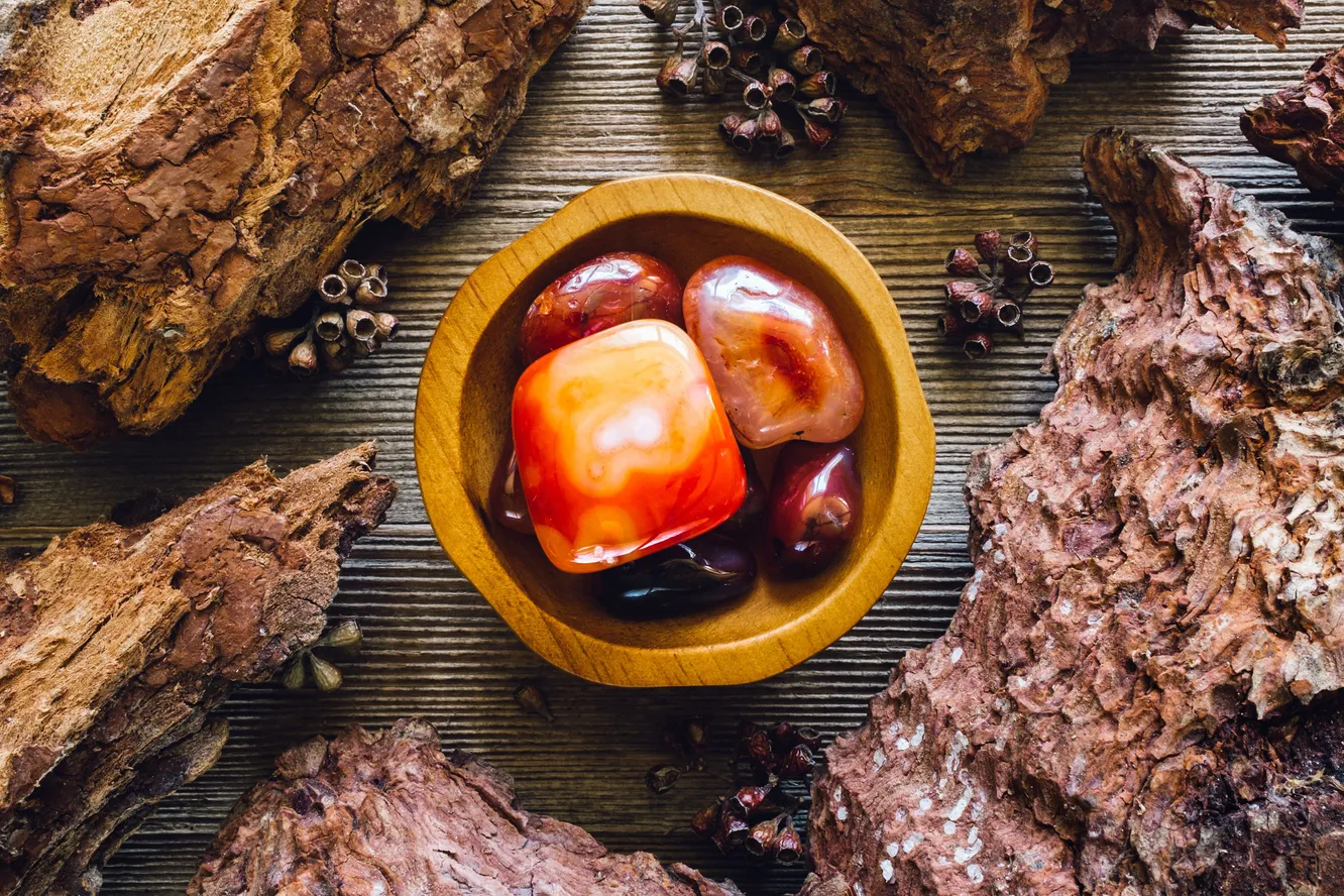 wooden bowl with Carnelian stones