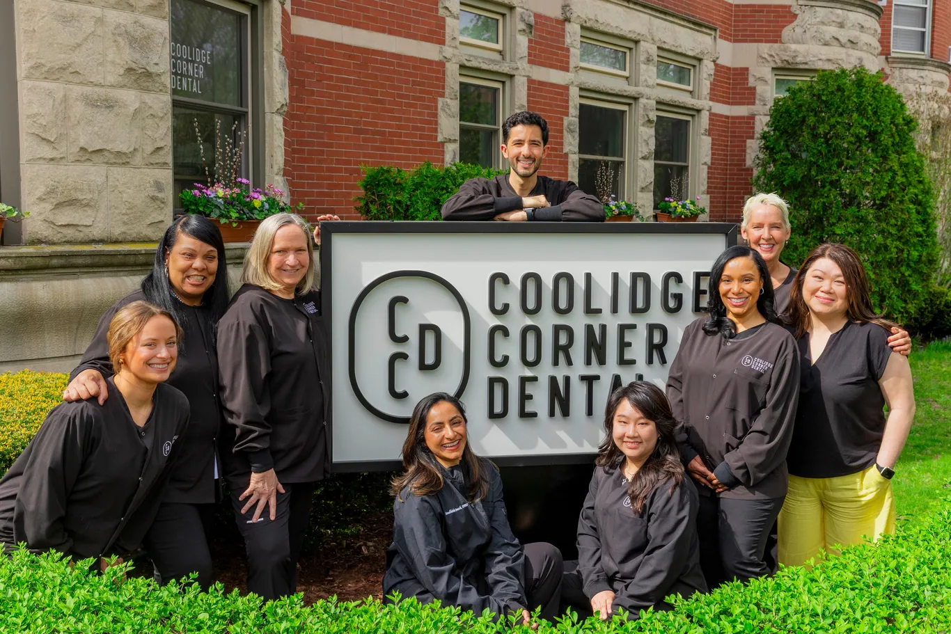 outdoor group photo of Dr. Sam Ustayev and dental staff of Coolidge Corner Dental, dentist in Brookline, MA 