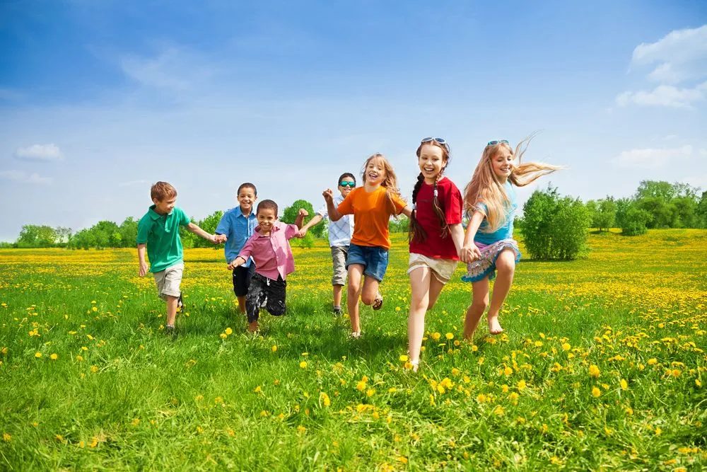 children running on grass