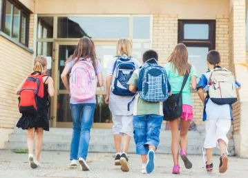 group of kids walking into school