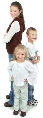 three kids posing and smiling