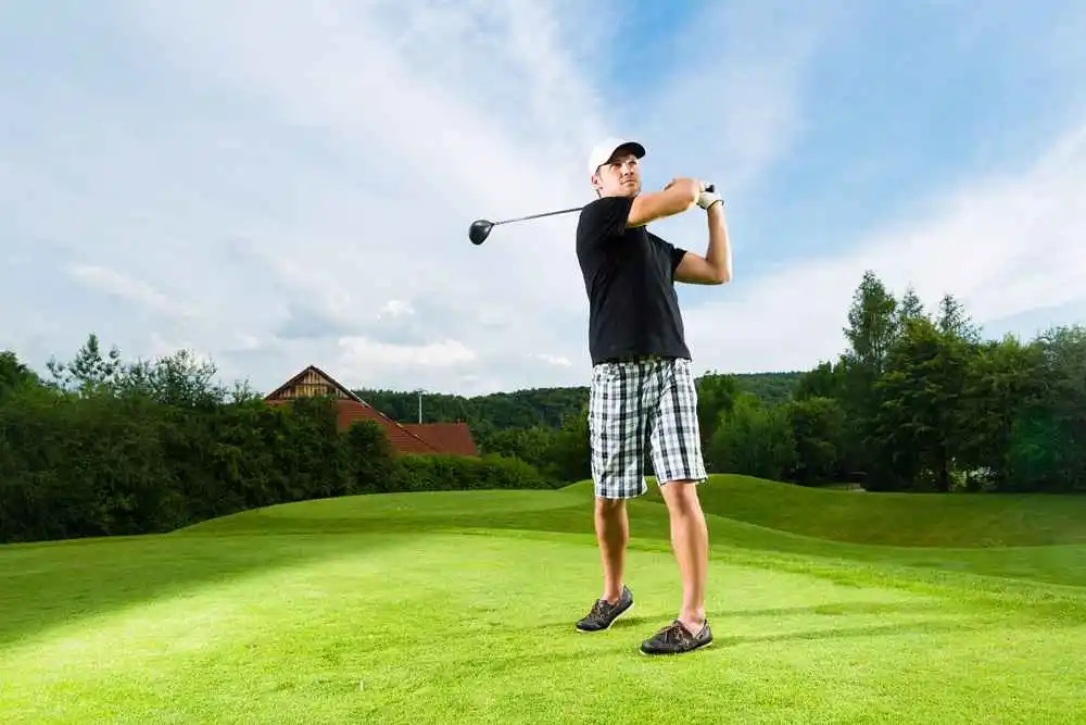 man playing golf 