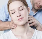 Woman with Doctor's Hands Examining Neck