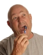 old bald white man brushing teeth caring for dentures Arlington, VA