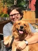 Stephen Giles with his golden retriever Mae