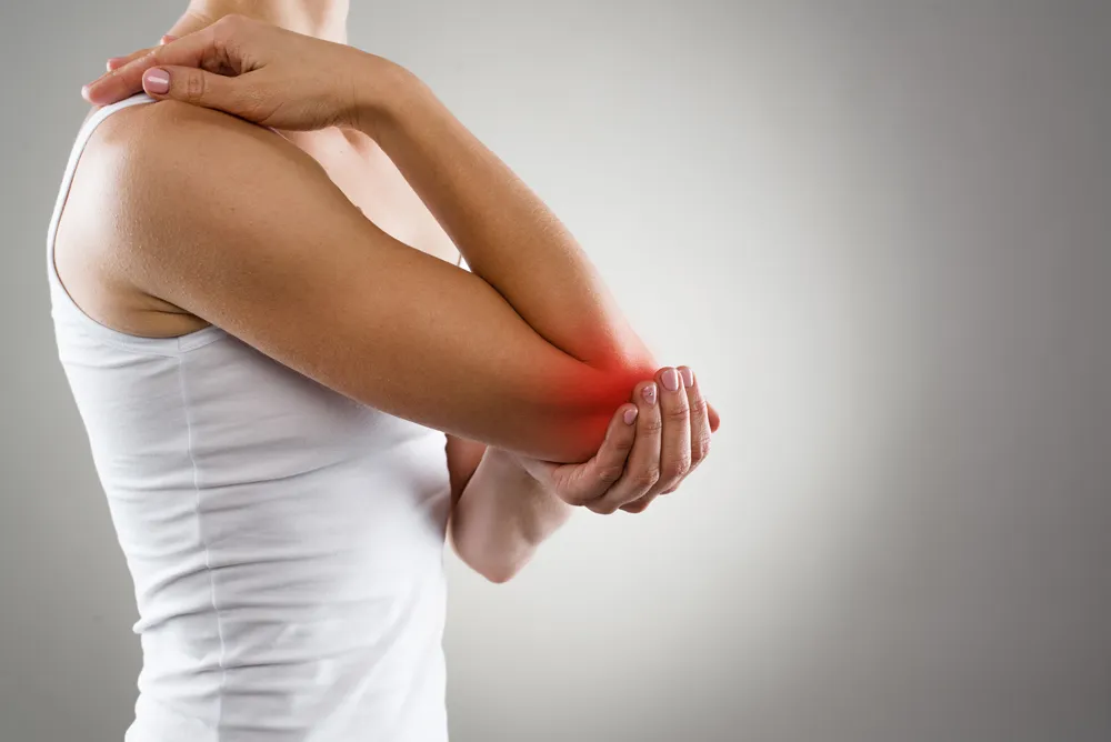 Woman suffering from elbow pain