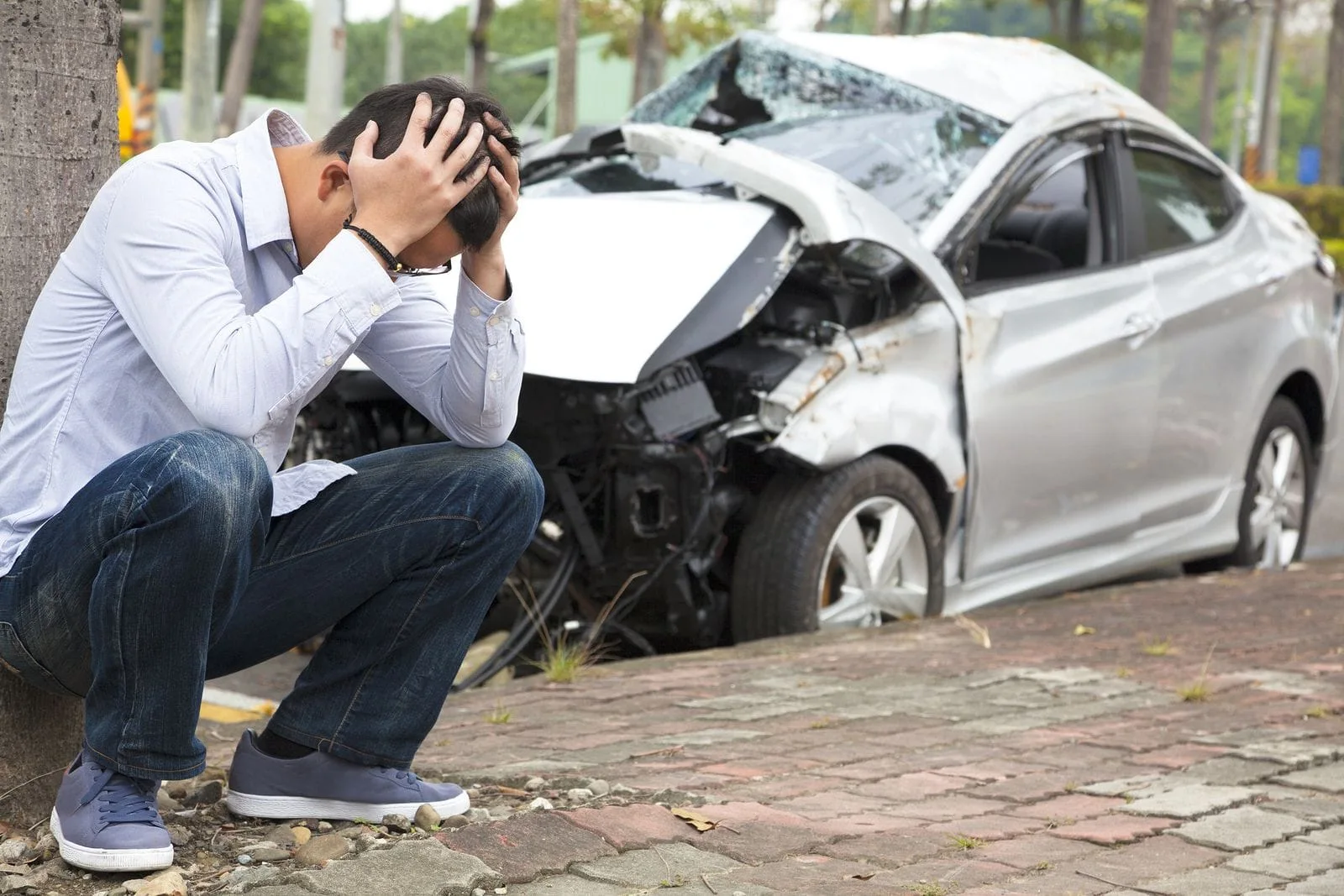 man holding his head after being in an auto accident injury 