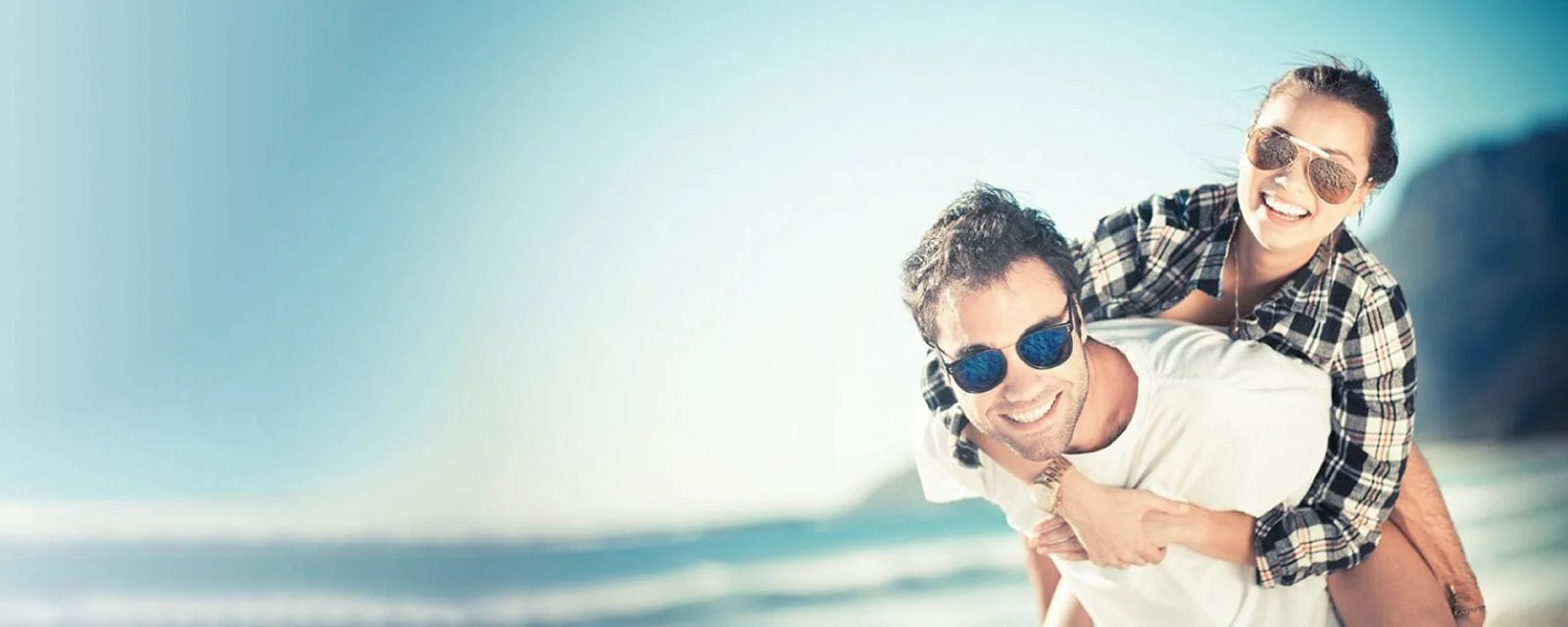 image of man and womand wearing sunglasses.