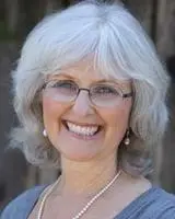 headshot of Dorothy Mandel, PhD, smiling happily