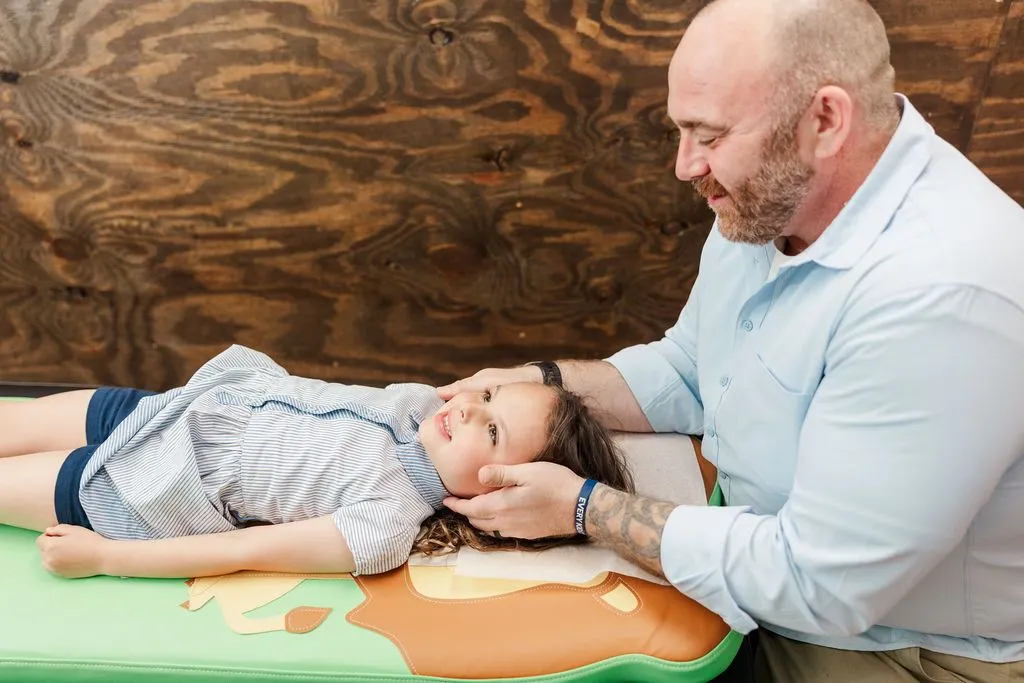 The “Doctor that cares,” helping to support this sweet girl’s nervous system!