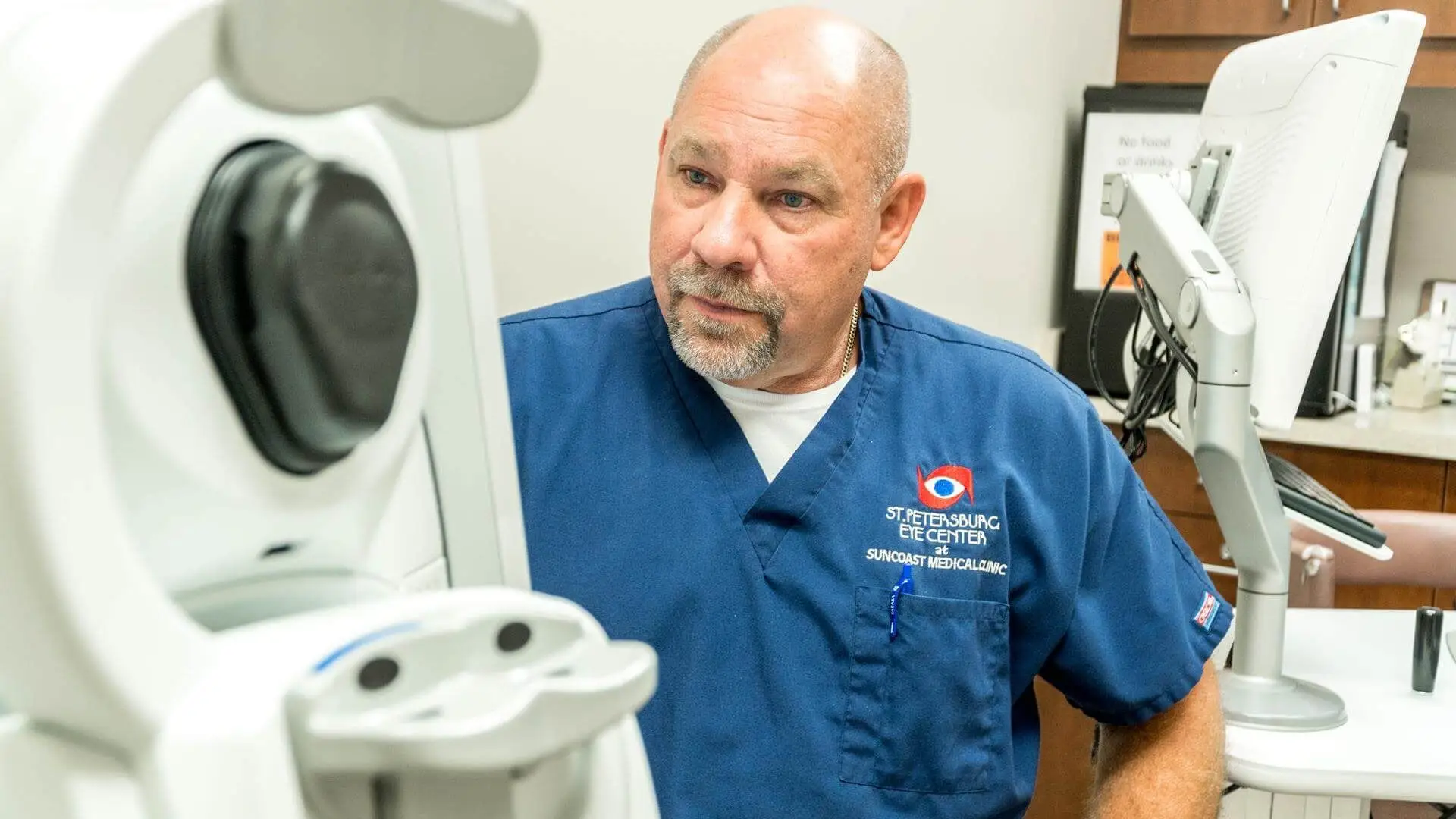 Dr. Mark Smith Looking at Machine 