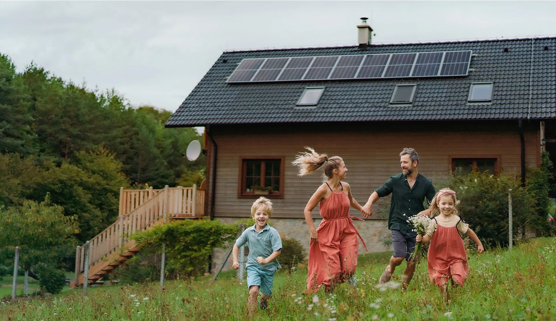 family running down a hill