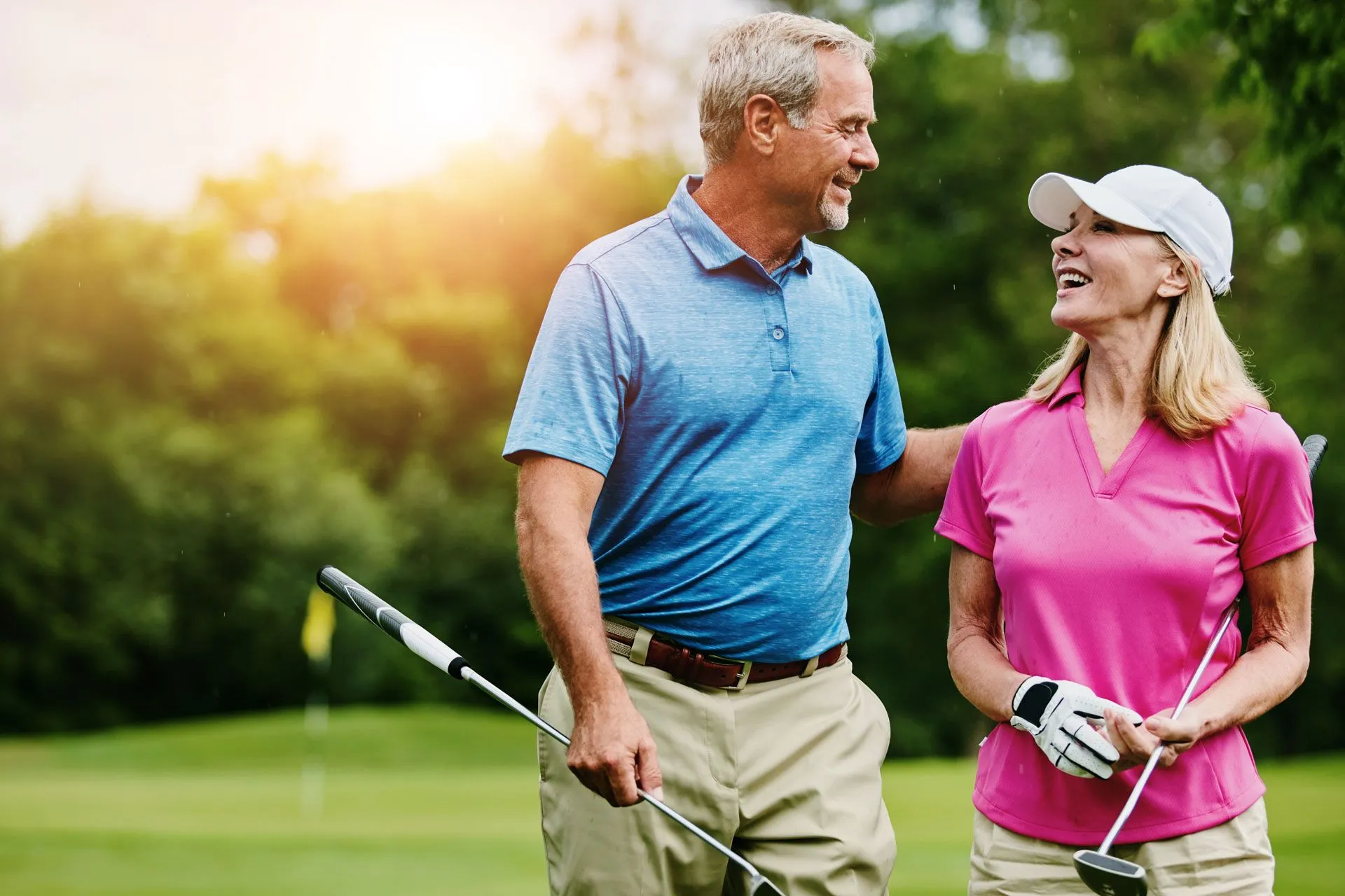 senior couple golfing