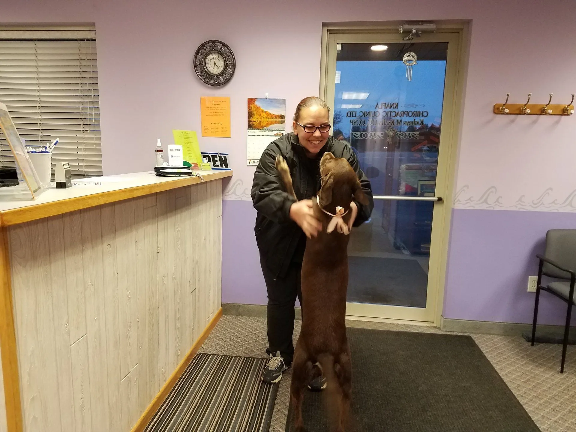 Dr. Knafla being greeted by the office dog