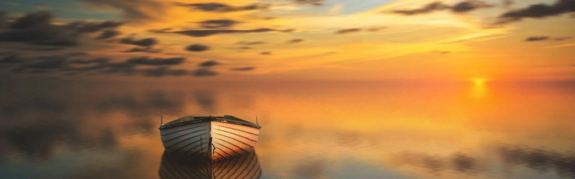 boat on the water at sunset