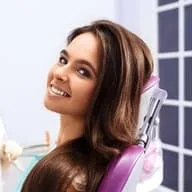girl in dental chair smiling