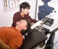 woman standing next to man on decompression table